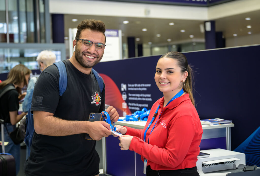 An attendee and a member of staff at the EHA2024 Congress.