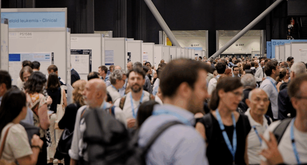 Dozens of EHA2025 delegates exploring the poster exhibition area.