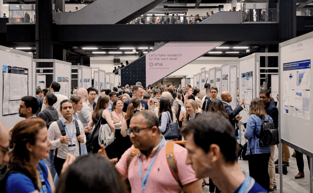 Dozens of EHA2025 delegates exploring the poster exhibition area.