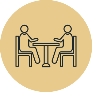 Graphic of two people sitting at a table.